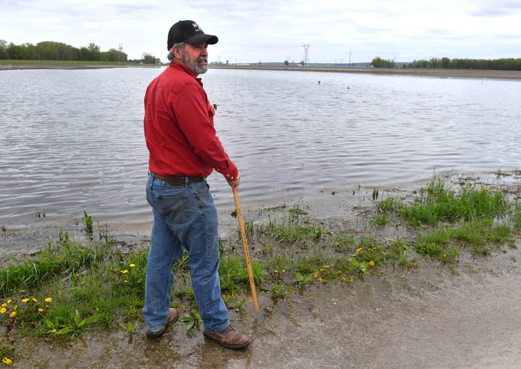 Farmers dealing with flooded fields.